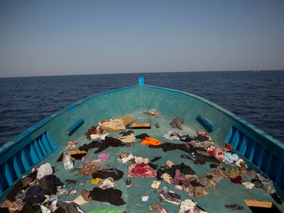PHOTO: Belongings left behind by migrants are seen in the floor of a wooden boat where more than seven hundred migrants were fleeing Libya, during a rescue operation in the Mediterranean sea, about 13 miles north of Sabratha, Libya, Aug. 29, 2016. 