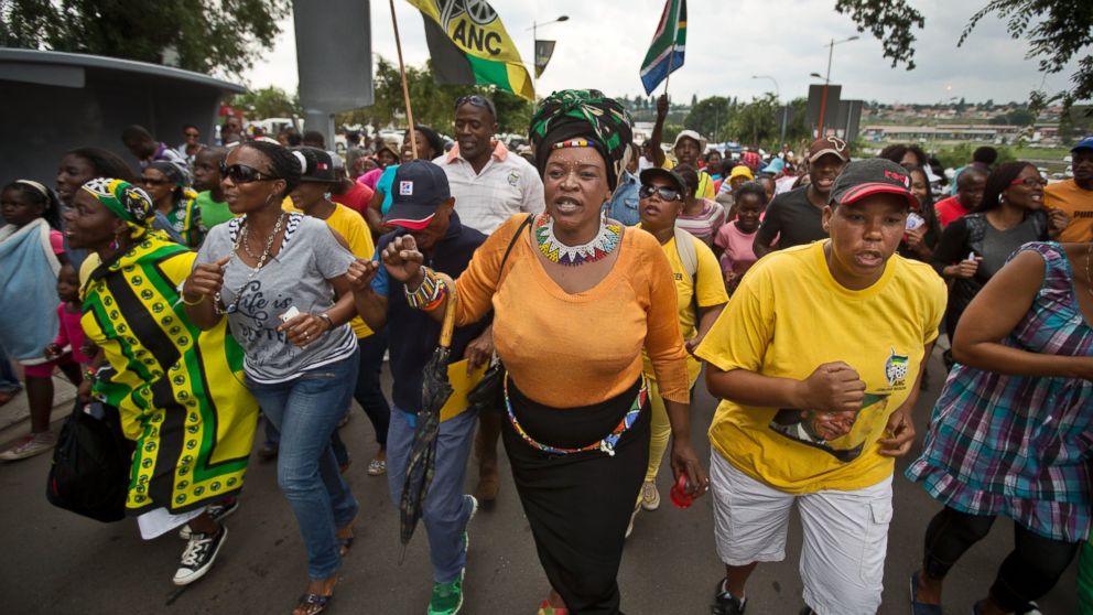 PHOTO: Township residents march to celebrate the life of Nelson Mandela