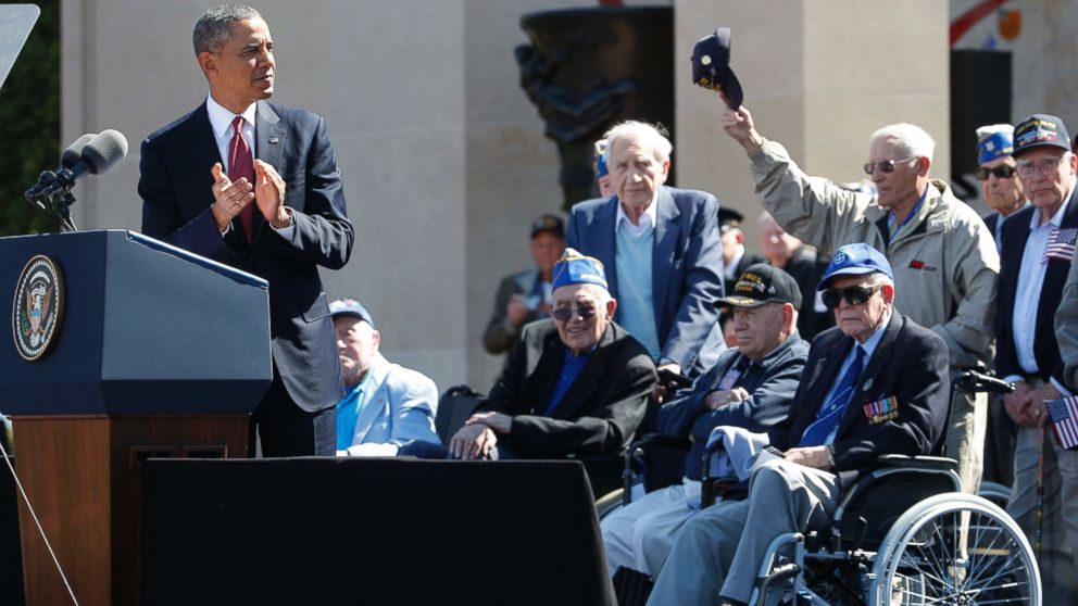 PHOTO: President Barack Obama acknowledges veterans as he speaks at Normandy American Cemetery at Omaha Beach as he participates in the 70th anniversary of D-Day in Colleville sur Mer in Normandy, France, June 6, 2014.