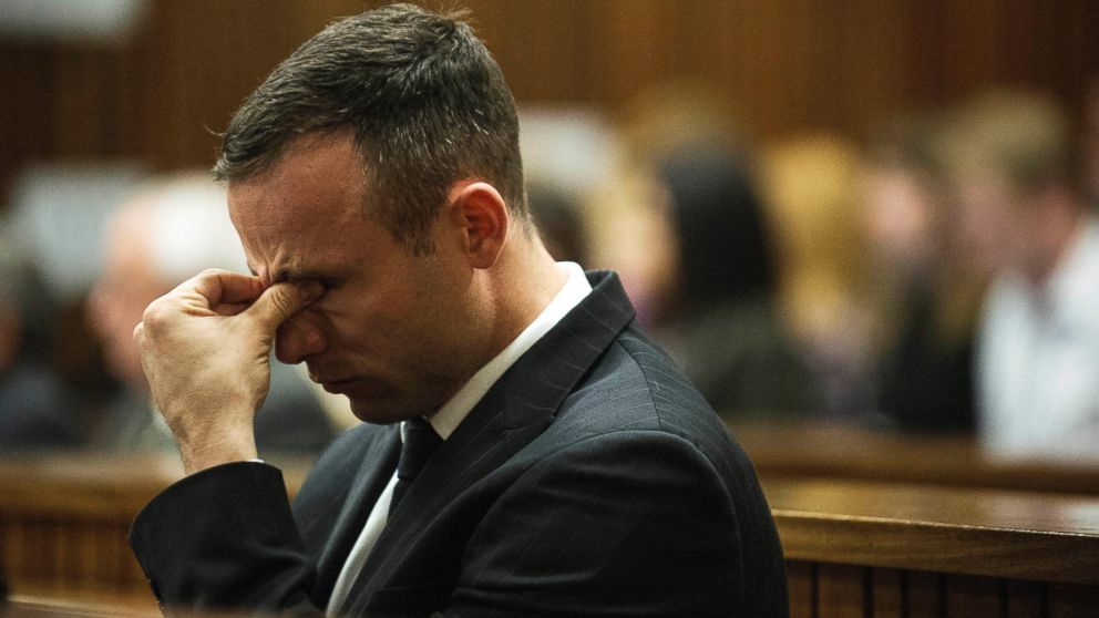 PHOTO: Oscar Pistorius reacts as he listens to forensic evidence being given in court in Pretoria, South Africa, April 16, 2014.