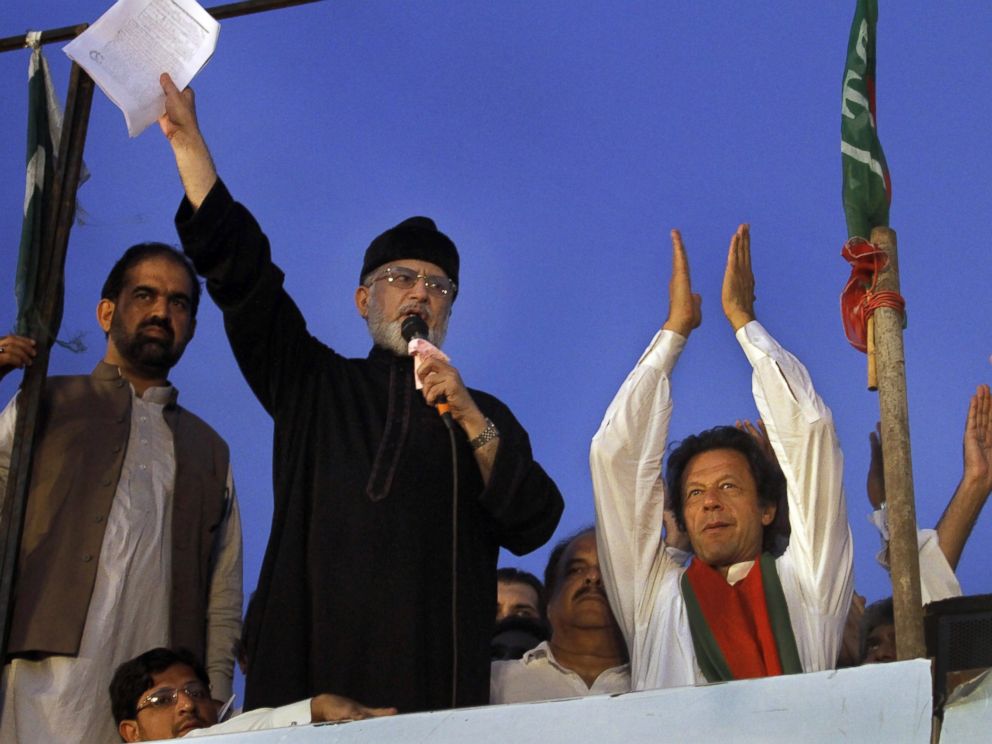 PHOTO: Pakistans fiery cleric Tahir-ul-Qadri, second left, delivers his speech during a protest in Islamabad, Pakistan, Sept. 2, 2014.