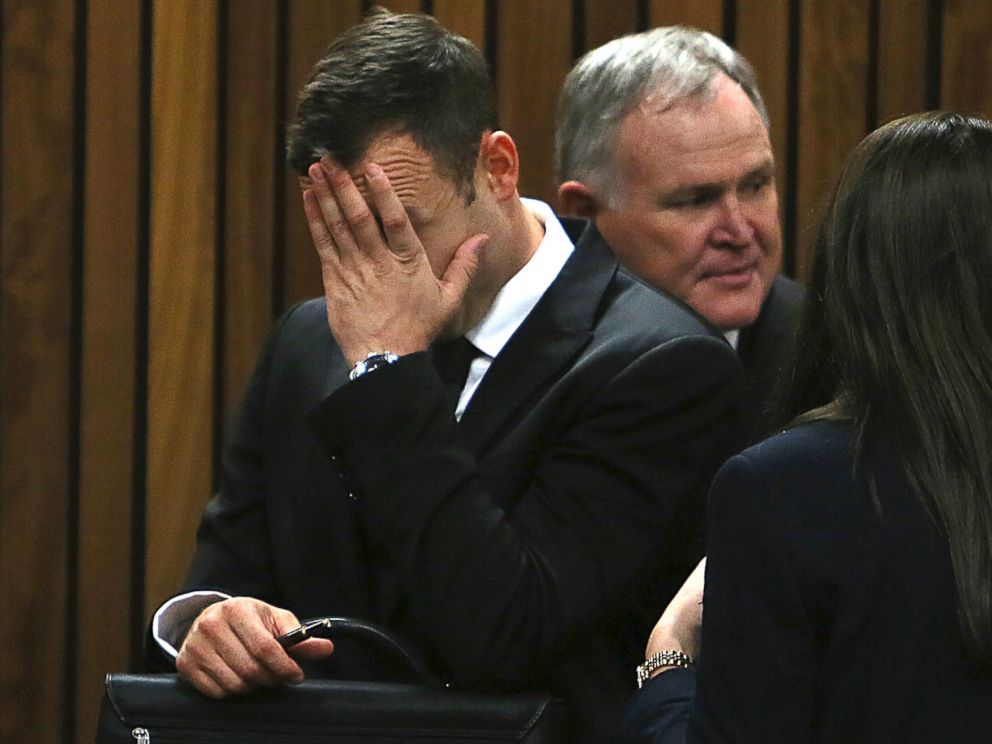 PHOTO: Oscar Pistorius puts his hand to his face at the end of the day in court on the third day of his trial at the high court in Pretoria, South Africa, March 5, 2014.