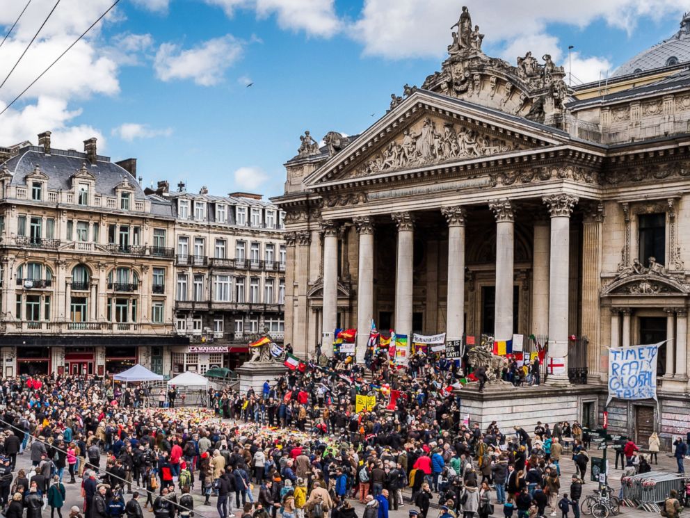 PHOTO: People gather at a memorial site at the Place de la Bourse in Brussels, March 27, 2016.