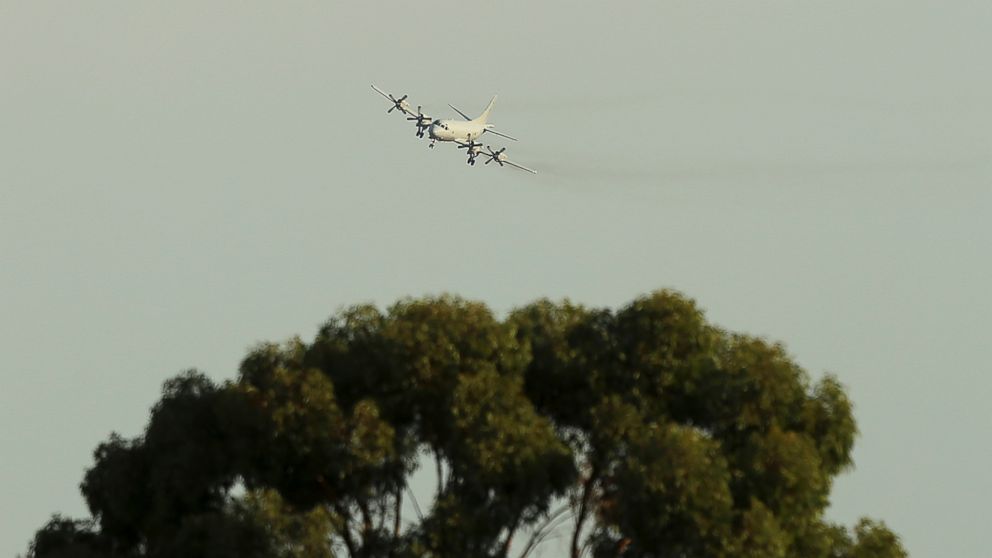 PHOTO: A Royal Australian Air Force P-3 Orion approaches RAAF Base Pearce as it arrives back from the on-going search operations for the missing Malaysia Airlines Flight 370 in Perth, Australia, April 8, 2014.