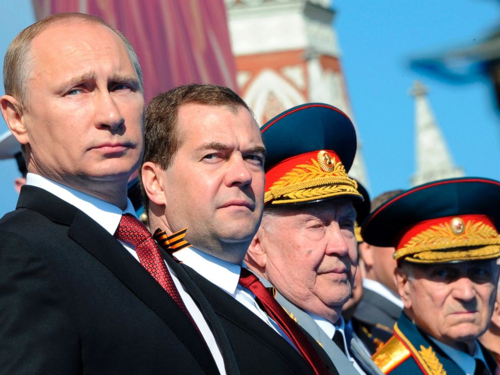PHOTO: Russian President Vladimir Putin, left, attends a Victory Day parade, which commemorates the 1945 defeat of Nazi Germany, at Red Square in Moscow, Russia on May 9, 2014.