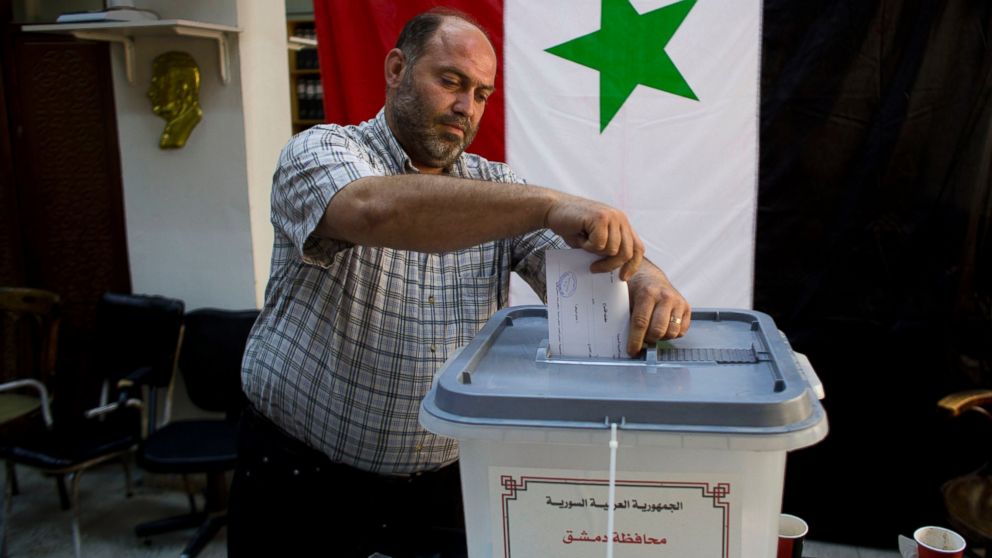 PHOTO: A man casts his ballot in Damascus, Syria, June 3, 2014.