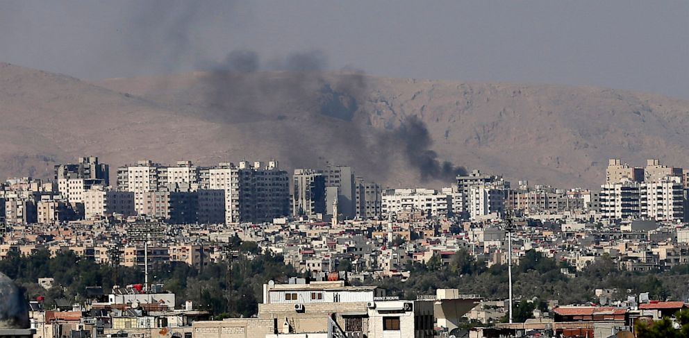 PHOTO: Black columns of smoke from heavy shelling in Syria