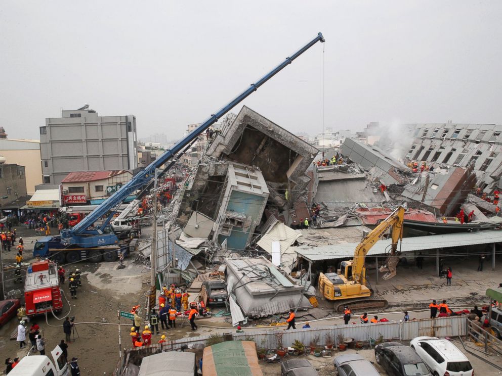 PHOTO: Rescue workers search a collapsed building from an early morning earthquake in Tainan, Taiwan, Feb. 6, 2016.