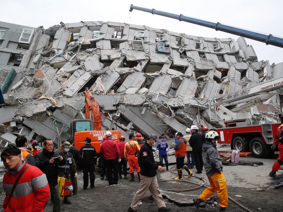 PHOTO: Rescue workers search a collapsed building from an early morning earthquake in Tainan, Taiwan, Feb. 6, 2016.