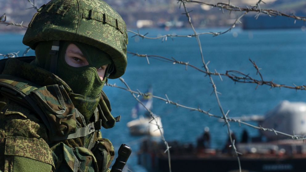 PHOTO: Russian soldiers guard a pier where two Ukrainian naval ships are moored, in Sevastopol, Ukraine, March 5, 2014.