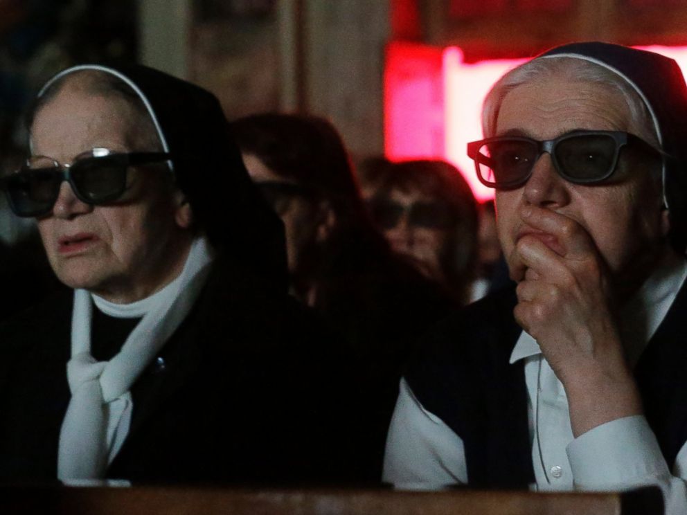 PHOTO: Nuns wear 3D glasses to watch the screening of the canonization of Pope John XXIII and Pope John Paul II taking place at the Vatican, at the parish church in Sotto il Monte Giovanni XXIII,Sunday, April 27, 2014.