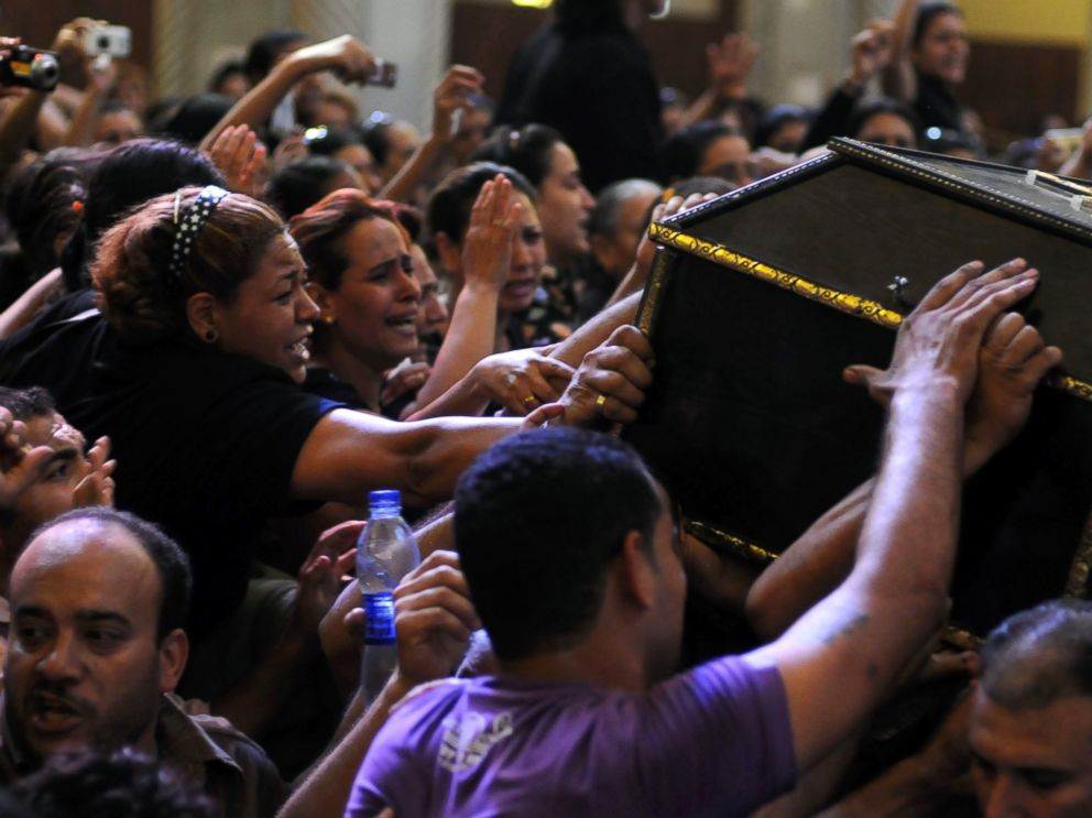 PHOTO: Egyptian Copts mourn over the coffin of a victim of deadly clashes, during a funeral at Abassaiya Cathedral in Cairo, Oct. 10, 2011, a day after 24 people, mostly Christians, died in clashes with Egyptian security forces.