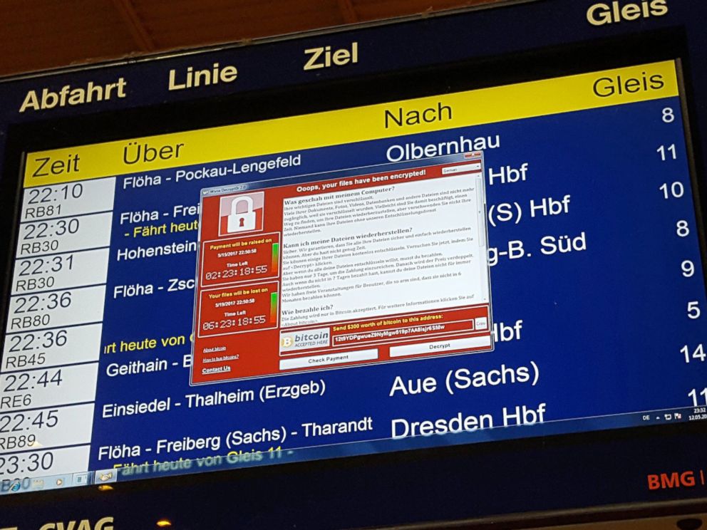 PHOTO: A window announcing the encryption of data including a requirement to pay appears on an electronic timetable display at the railway station in Chemnitz, eastern Germany, May 12, 2017.