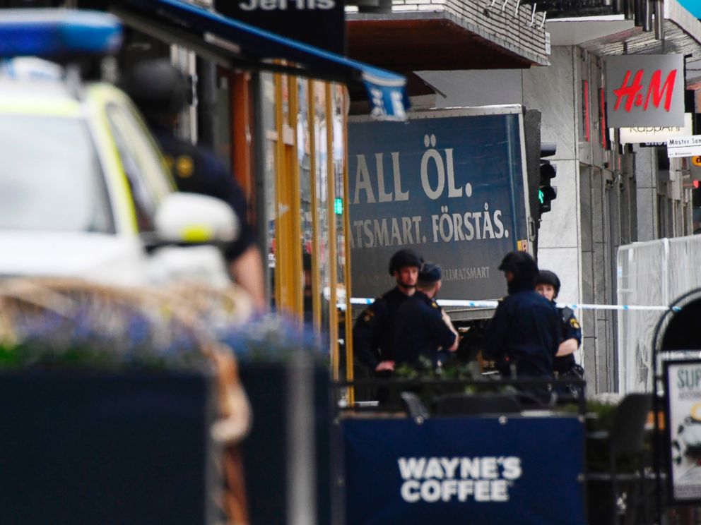 PHOTO: Police work at the scene where a truck crashed into the Ahlens department store at Drottninggatan in central Stockholm, April 7, 2017.
