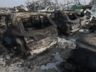 PHOTO: Burnt cars are seen in the debris following the explosions of a warehouse in Binhai New Area on Aug. 13, 2015 in Tianjin, China. 