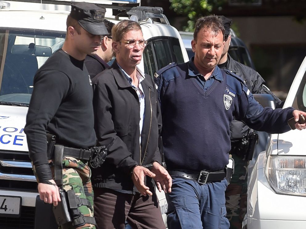 PHOTO: Seif Eldin Mustafa leaves the court in Larnaca escorted by Cypriot police, March 30, 2016.