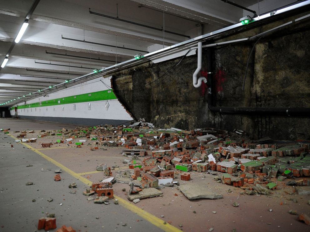 PHOTO: Fallen bricks from a wall in a car park are seen following an explosion at Maelbeek metro station following an attack on March 22, 2016 in Brussels.