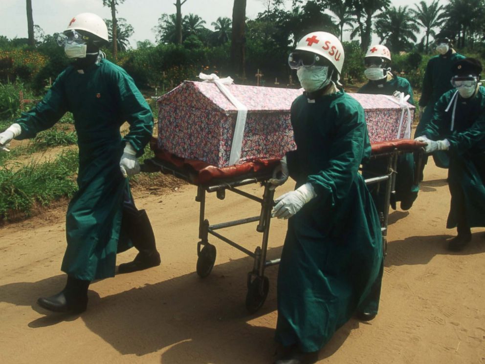 PHOTO: Health workers transport the casket of a nun whose death resulted from an Ebola infection on Jan. 1, 1995 in Kikwit, Zaire. 