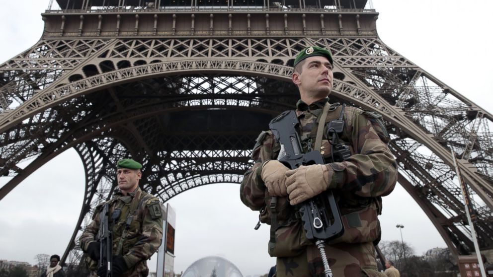 PHOTO: French soldiers patrol in front of the Eiffel Tower on Jan. 7, 2015 in Paris as the capital was placed under the highest alert status after heavily armed gunmen shouting Islamist slogans stormed French satirical newspaper Charlie Hebdo.