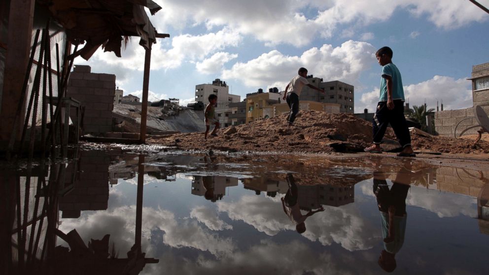 PHOTO: Palestinians inspect a house destroyed in air attacks staged by the Israeli army in Gaza City, Gaza, July 14, 2014.