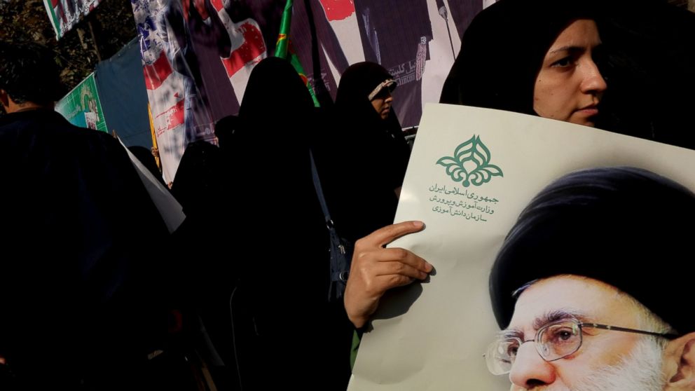 PHOTO: A Iranian protester holds a photo of supreme leader Ayatollah Ali Khamenei during a demonstration to mark the 34th anniversary of the 1979 U.S. embassy takeover Nov. 4, 2013, in Tehran, Iran.