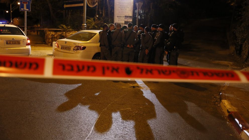 PHOTO: Israeli security forces gather behind a security perimeter outside the Menachem Begin Heritage Center where a Jewish activist was wounded during a shooting on Oct. 29, 2014 in Jerusalem. 