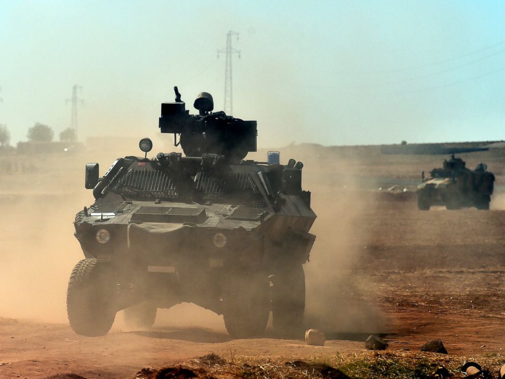 PHOTO: Turkish army patrols near the Turkish-Syrian border area near the Syrian town of Ain al-Arab, known as Kobani by the Kurds, in the southeastern town of Suruc, Turkey, Oct. 7, 2014.