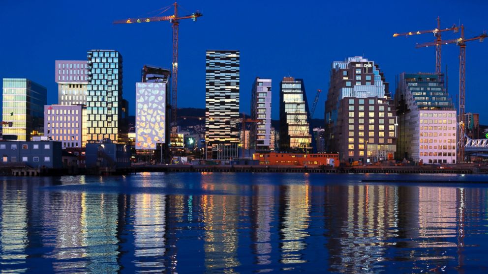 PHOTO: Buildings of The Barcode Project are reflected on the water at sunset in Oslo, Nov. 18, 2012.