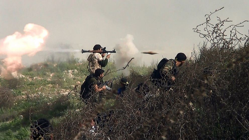 PHOTO: An image grab taken from a video shows an opposition fighter firing a rocket propelled grenade (RPG), Aug. 26, 2013, during clashes with regime forces over the strategic area of Khanasser, situated on the only road linking Aleppo to central Syria.
