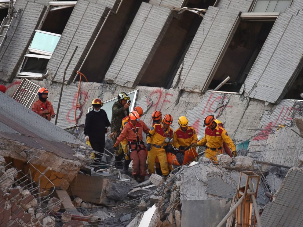 PHOTO: Rescue personnel bring down a Vietnamese national, identified as 28-year old Chen Mei-Jih, to safety after she was extracted from a building which collapsed in the earthquake in the southern Taiwanese city of Tainan, Feb. 8, 2016.