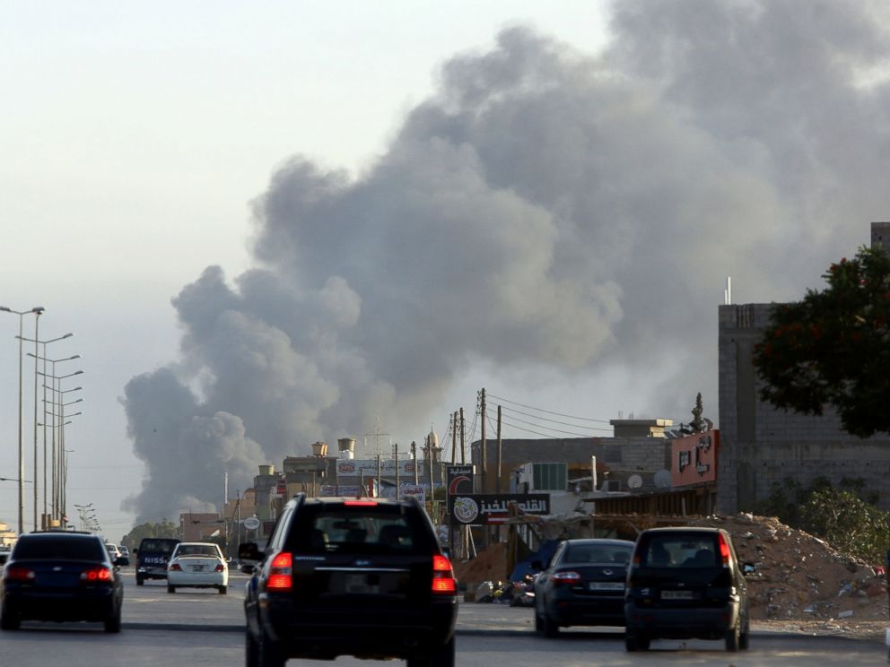 PHOTO: Smoke billows from an area near Tripolis international airport as fighting between rival factions around the capitals airport continues on July 24, 2014.