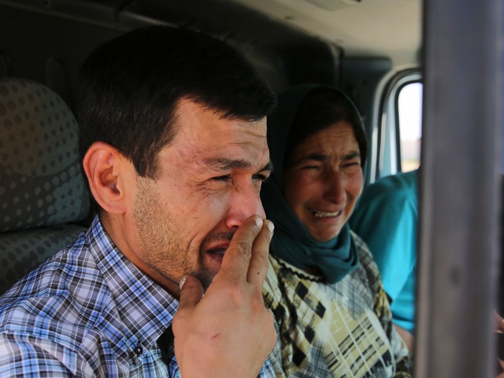 PHOTO:Abdullah Kurdi, father of Syrian children Aylan, 2, Galip, 3, and husband of Rehan Kurdi, 27, cries on his way to the Syrian border town of Kobani to hold funeral of his family, Sept. 4, 2015.
