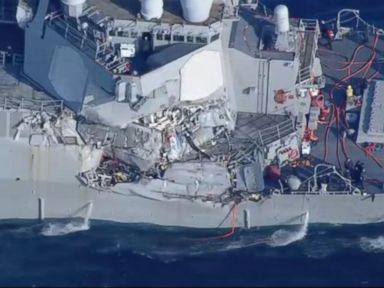Navy destroyer collides with container ship; sailors missing