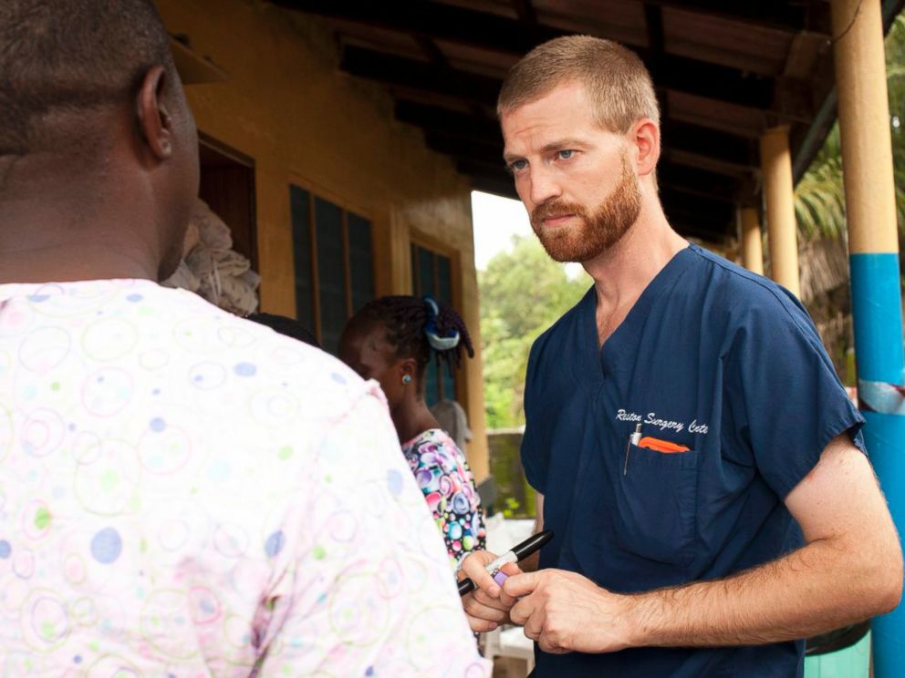 PHOTO: Dr. Kent Brantly speaks with a worker outside the ELWA Hospital in Monrovia, Liberia