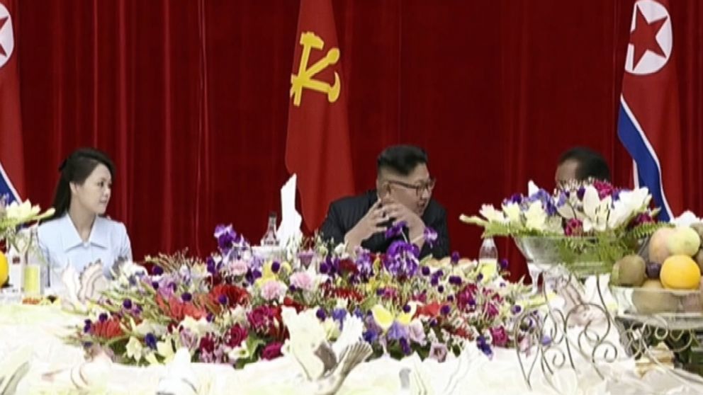 Kim Jong Un and his wife host banquet for ICBM developers