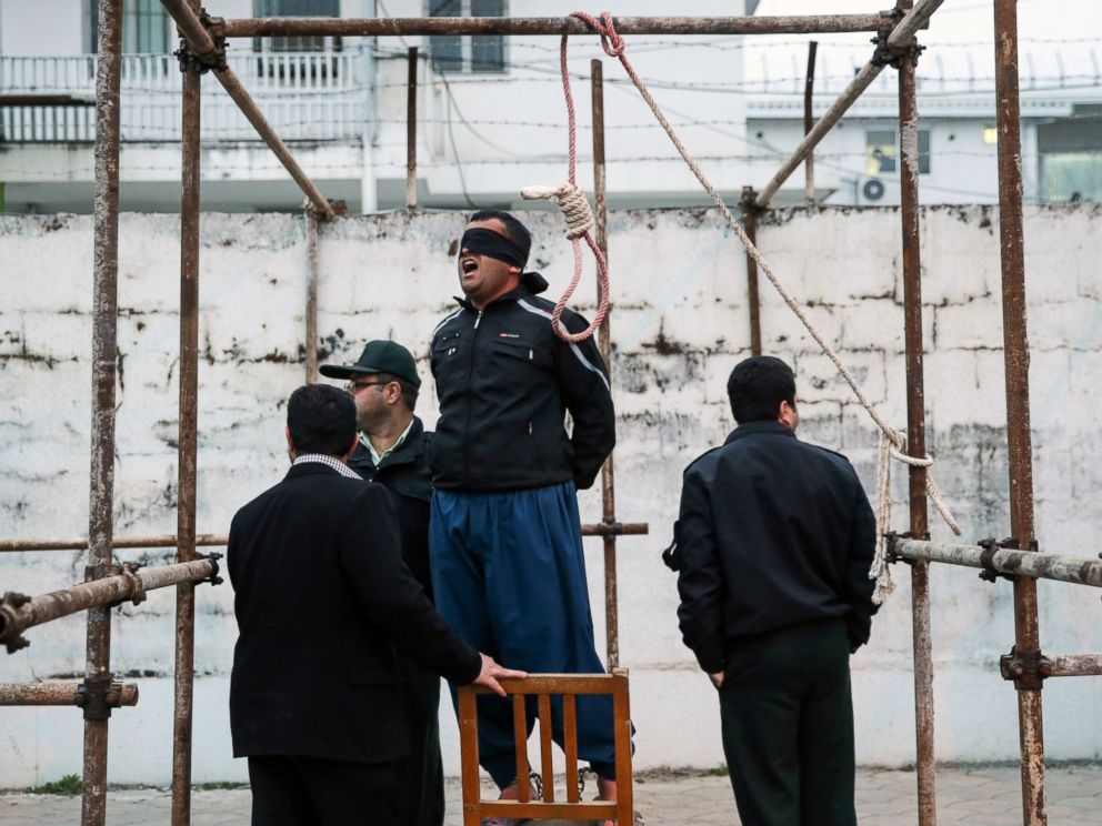 PHOTO: Balal, who killed Abdolah Hosseinzadeh in a street fight with a knife in 2007, reacts as he stands in the gallows during his execution ceremony in Nowshahr, Iran, April 15, 2014. 