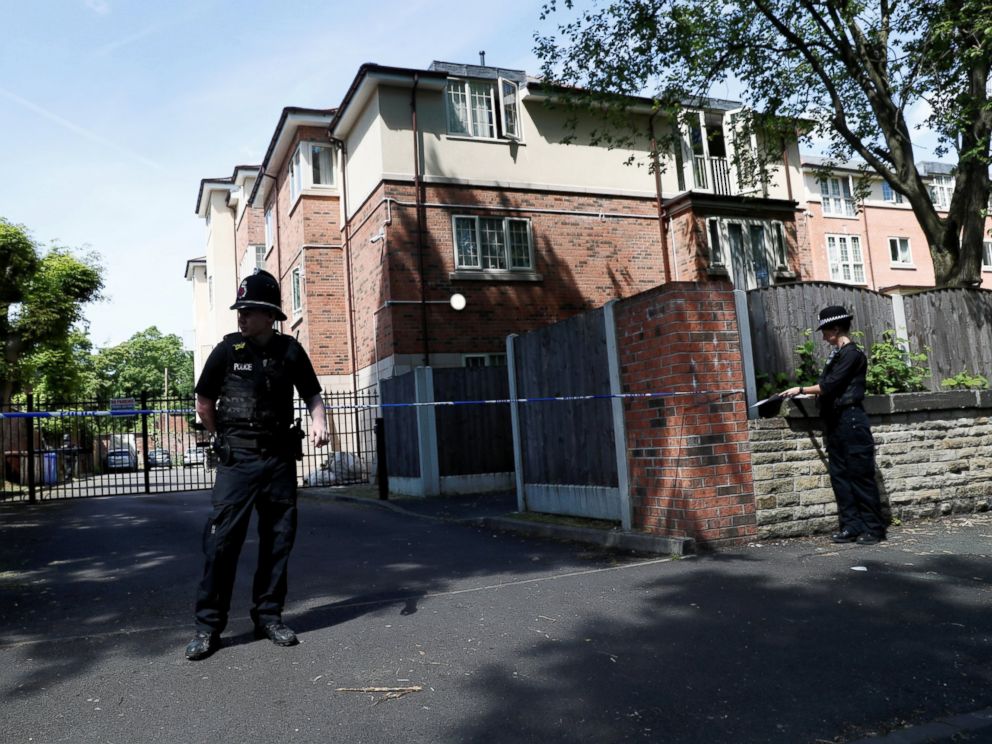 PHOTO: Police officers stand outside a residential property near to where a man was arrested in the Chorlton area of Manchester, England, May 23, 2017.