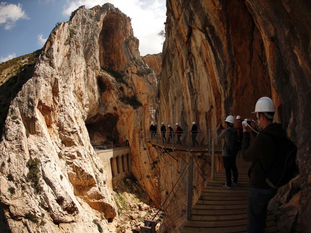 PHOTO: Journalists walk along the new Caminito del Rey (The Kings Little Pathway) in El Chorro-Alora, near Malaga, southern Spain March 15, 2015.