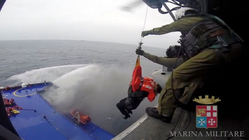 PHOTO: A person is lifted on an Italian Navy helicopter as the car ferry Norman Atlantic burns in waters off Greece, Dec. 28, 2014, in this handout video grab of the Italian Marina Militare. 