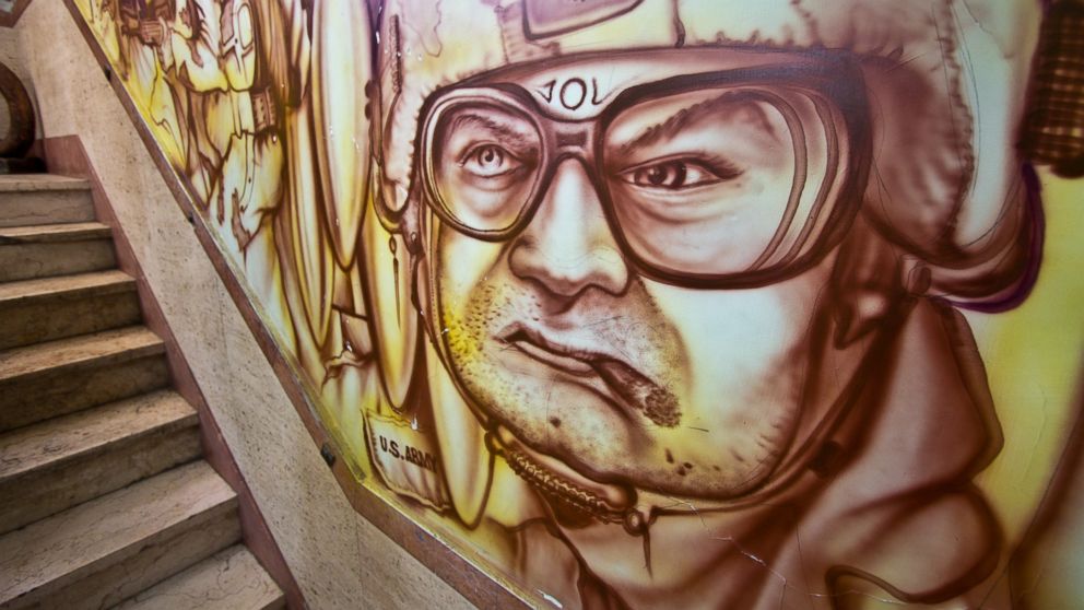 PHOTO: The image of a U.S. soldier smoking a cigarette is part of a large mural painted on the inside of a stairwell at the former U.S. Embassy in Tehran, Iran.