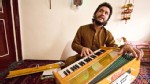 PHOTO: 23-year old Naweed Forugh, a former winner of Afghanistan's version of American Idol, plays the harmonia, a traditional Afghan musical instrument, in his living room. After nearly losing his life to an unknown gunman, Forugh is too afraid to leave 