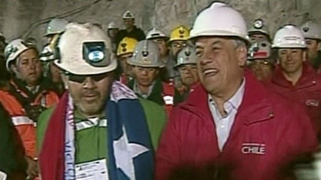 VIDEO: Crowds join President Sebastian Pinera in song as the final miner is rescued.