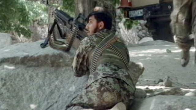 PHOTO: An Afghan soldier is seen during a firefight against the Taliban, July 4, 2012.