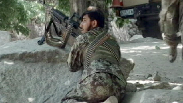 PHOTO: An Afghan soldier is seen during a firefight against the Taliban, July 4, 2012.