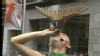 VIDEO: An Australian street performer sets new record by swallowing 18 swords at once.