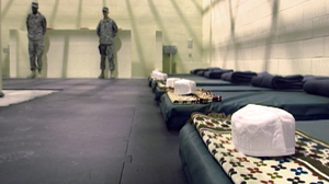 PHOTO A communal cell with prayer rugs, caps and sleeping mats at the detention facility at Parwan, Afghanistan, is shown, Nov. 15, 2009.