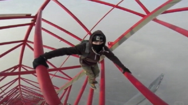 VIDEO: A pair of Russian men climbed the unfinished, 2,100-foot Shanghai Tower in China.