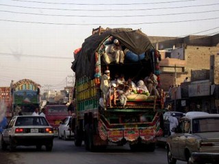 PHOTO A truck loaded with people passes through Takht Bhai, Pakistan from Swat Valley, on Sunday, May 10, 2009.