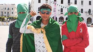PHOTO pro-Ghadafi supporters in Tripolis Green Square wearing the countrys signature color.