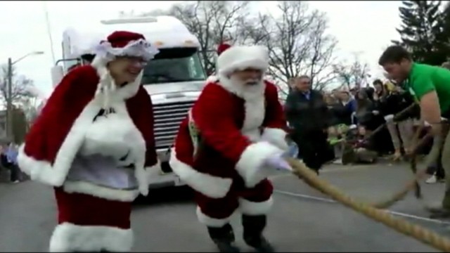 VIDEO: Dressed as Santa, the Rev. Kevin Fast breaks a world record for pulling the heaviest sleigh.